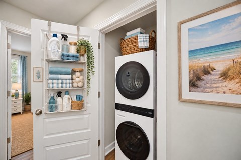 A white door with a basket on top of a washing machine.