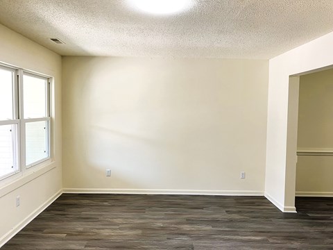 A room with a window and a door.