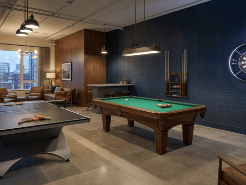 A pool table in a room with a dartboard on the wall.