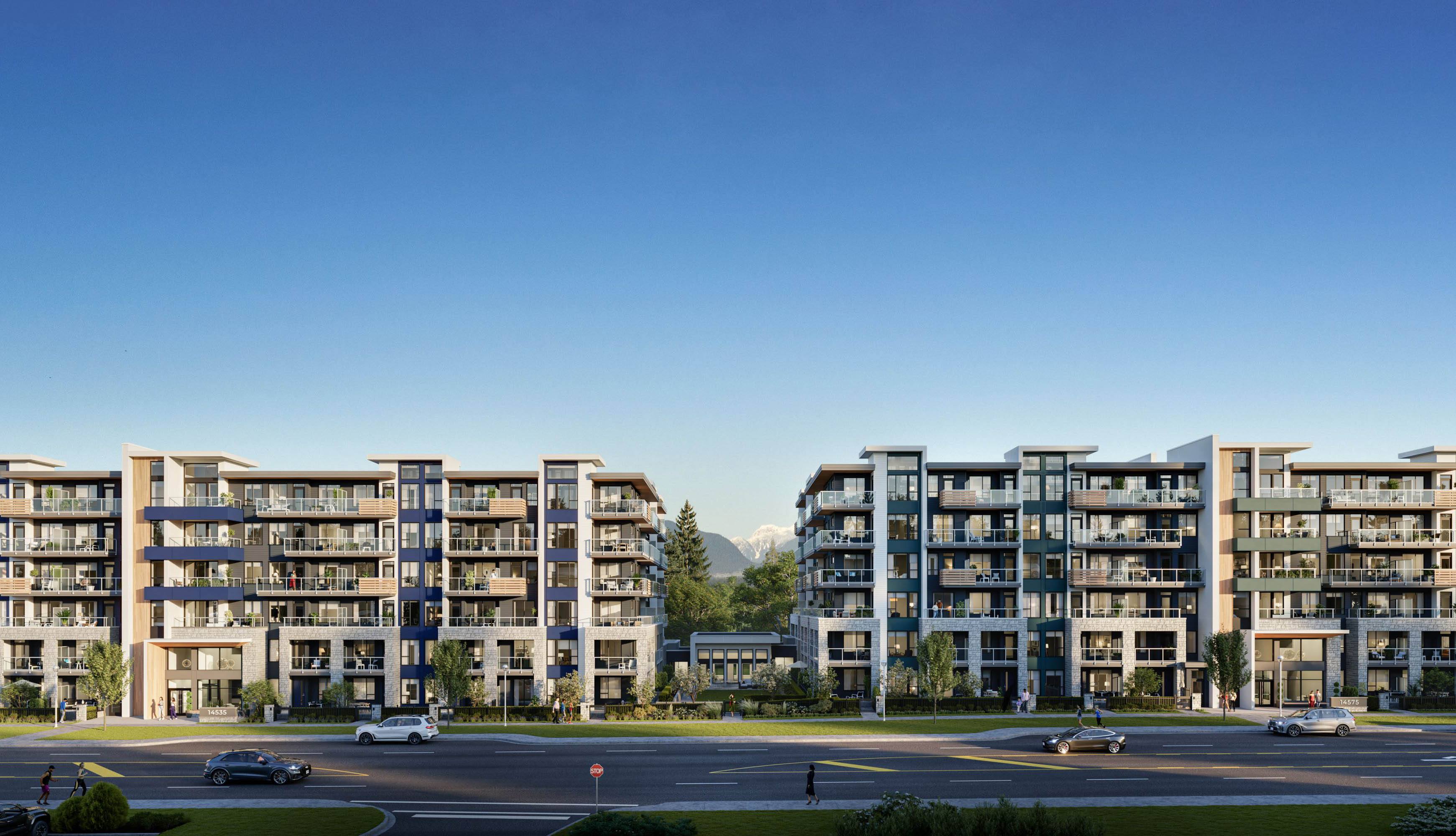 A large apartment complex with a parking lot in front.