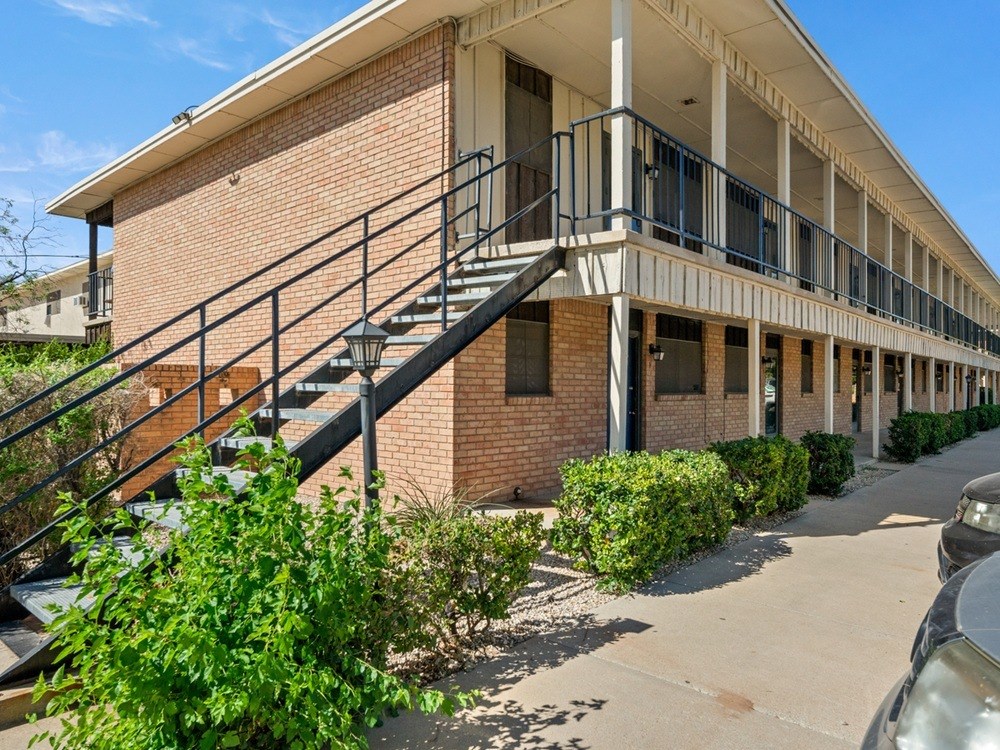 A building with a staircase leading to the second floor.