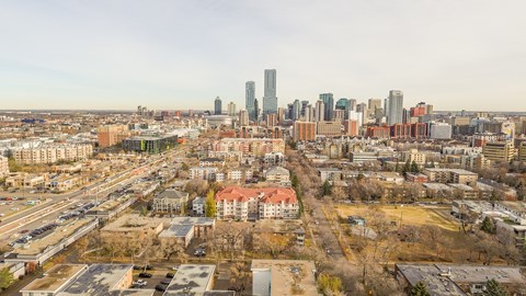 A cityscape with a mix of residential and commercial buildings.