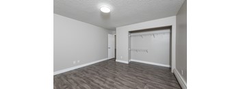 A room with a grey floor and a white ceiling.