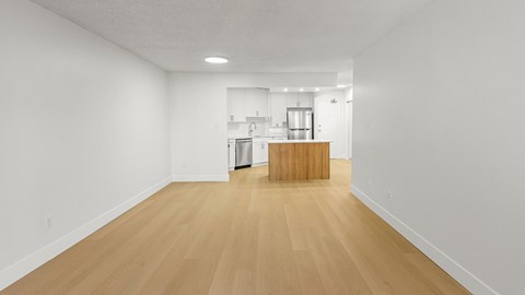 A room with wooden floors and white walls.