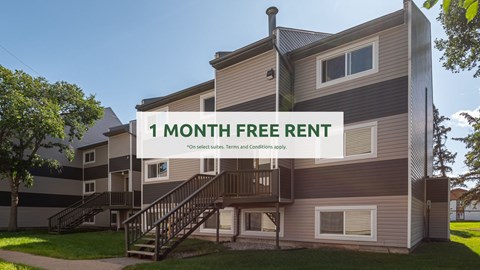 A modern apartment building offers a 1 month free rent deal.