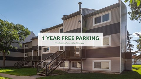 A building with a sign offering 1 year free parking.