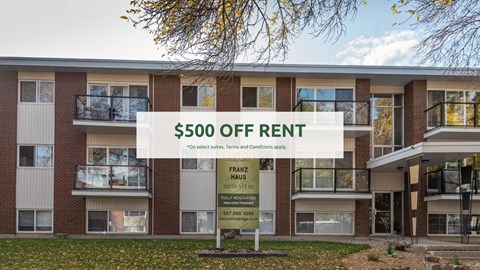 A building with a sign offering $500 off rent.