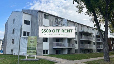 A building with a sign that says $500 off rent.
