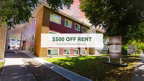 A building with a sign that says "$500 OFF RENT" in front of it.