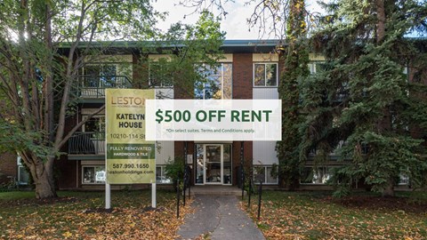 A sign in front of a house advertises a $500 off-street parking.