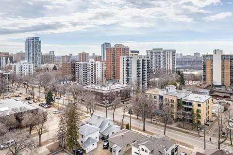A cityscape with a mix of residential and commercial buildings.