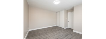 A room with a grey floor and white walls.