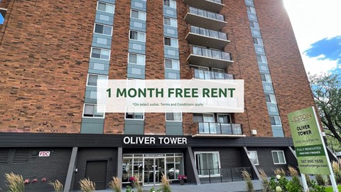 Oliver Tower building with a sign offering a free one month rent.