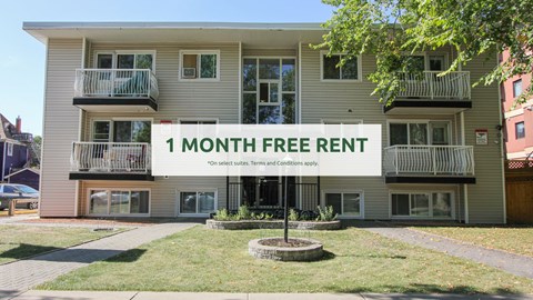 A building with a sign that says "1 MONTH FREE RENT" in front of it.