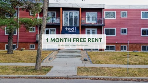A red building with a sign offering a one month free rent.