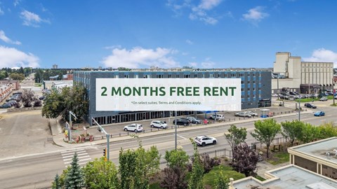 A large billboard advertises a 2 months free rent offer.