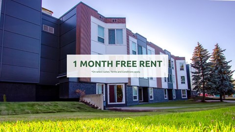A modern building with a sign offering a free one month rent.