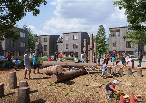 A playground with children playing and a building in the background at The Grindstone Apartments, Waterdown