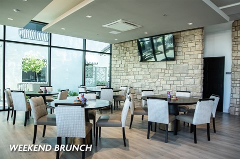 A dining room with a table set for a weekend brunch.