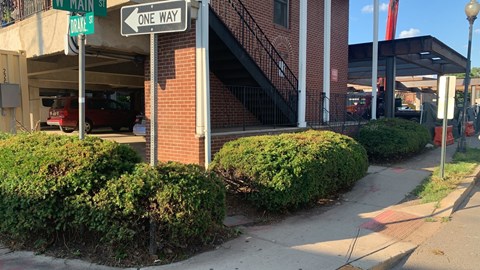 A street view with a one way sign.