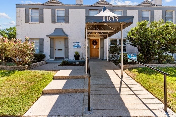 The front of apartment building number 1103 is shown with a leasing sign.