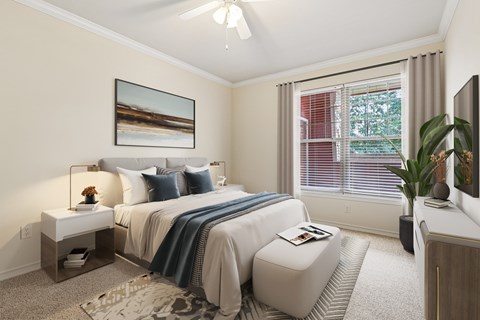 A bedroom with a large bed and a painting on the wall.