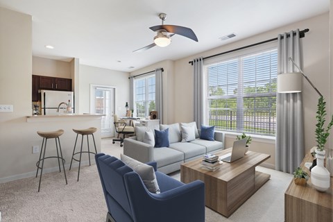 A modern living room with a blue chair and a coffee table.