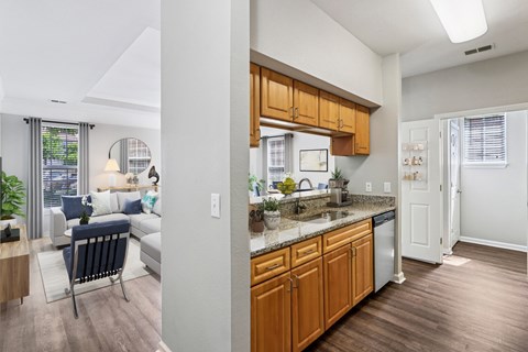 A kitchen with wooden cabinets and a white refrigerator.