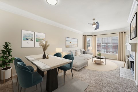 A well-lit, modern living room with a dining table and chairs.