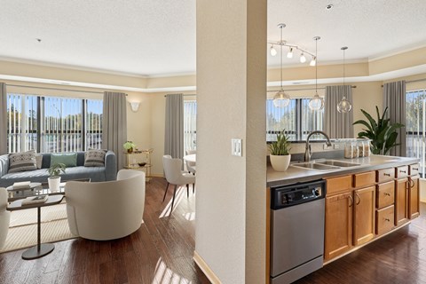 A modern kitchen with wooden cabinets and a large island.
