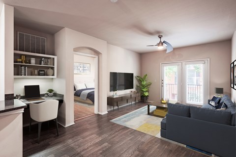 A modern living room with a grey couch and a television.