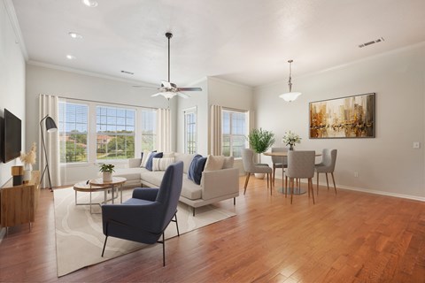 A living room with a dark blue chair in the center.