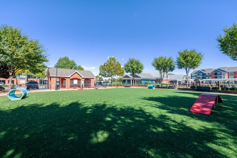 A playground with a red slide and a blue ball pit.