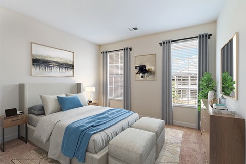 A bedroom with a large bed and a window with blinds.