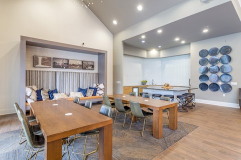 A dining room with a wooden table and chairs.