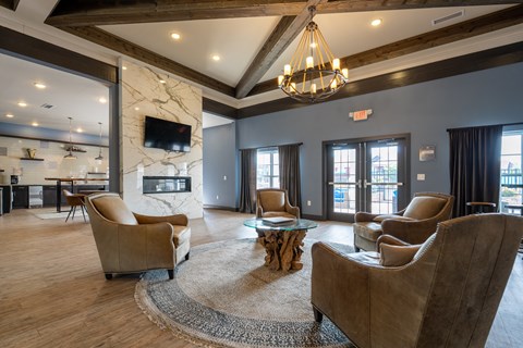 A living room with a fireplace and a television.
