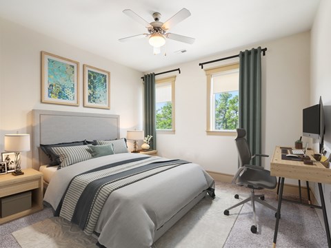 A bedroom with a large bed, a desk, and a chair.