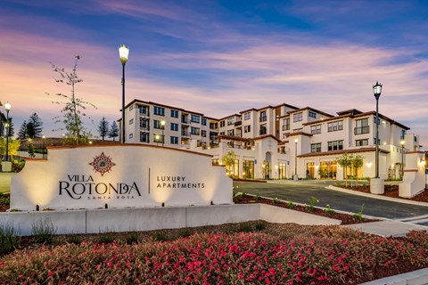 The image shows the front view of Villa Rotonda Luxury Apartments in Santa Rosa.