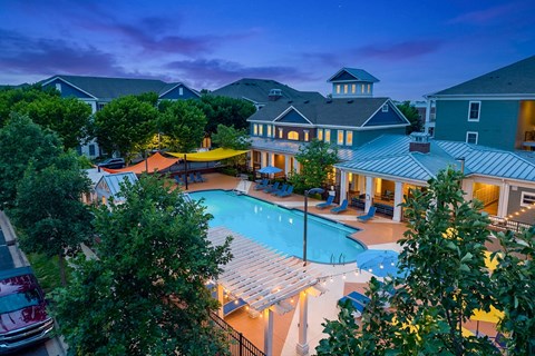 A large house with a pool in the backyard.