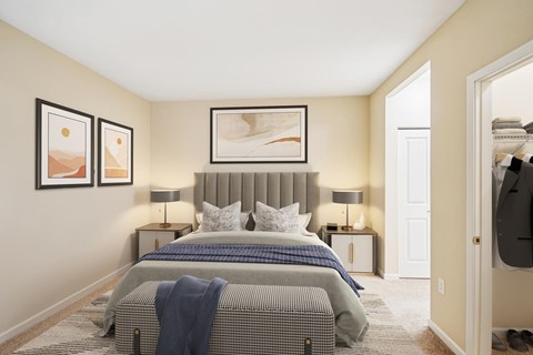A bedroom with two beds and a painting on the wall.