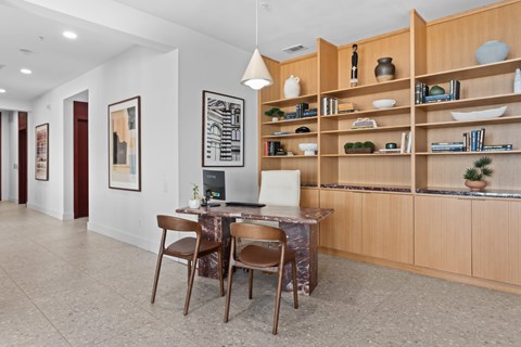 A dining area with a table and chairs.