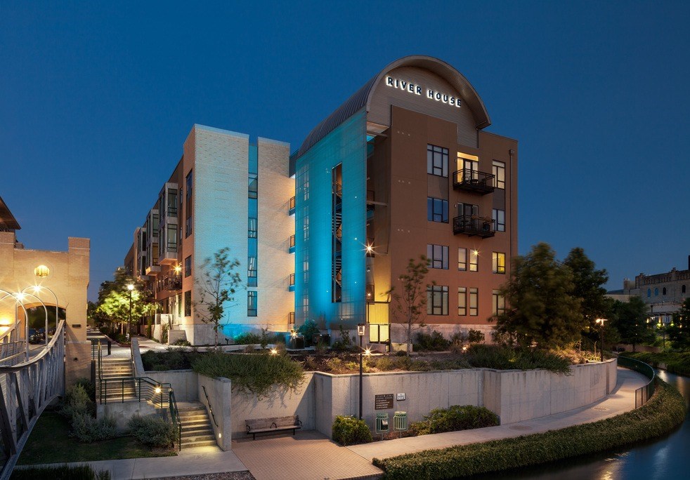A modern building with a curved glass facade and a sign that reads "CIVIL BELLE".