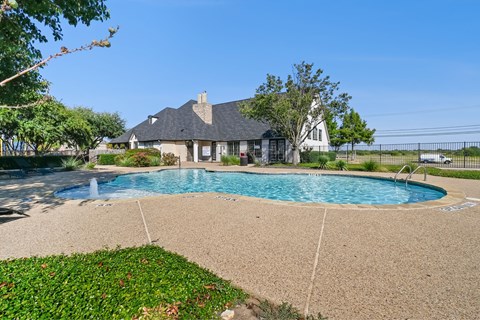 A house with a pool in the backyard.