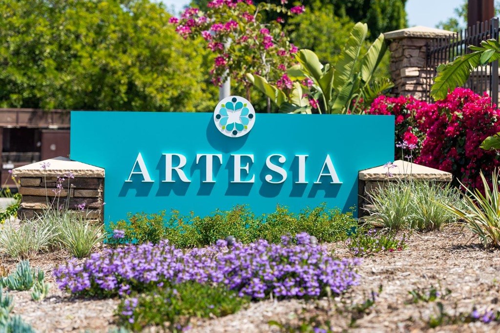 A blue sign with the word ARTESIA on it in white letters.