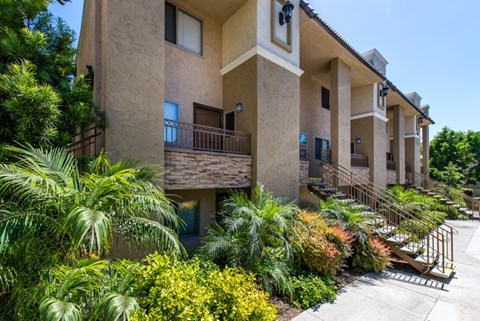 A building with a balcony and a metal railing.
