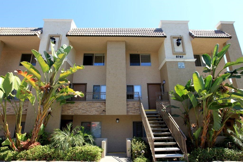 A large house with a staircase leading to the front door.