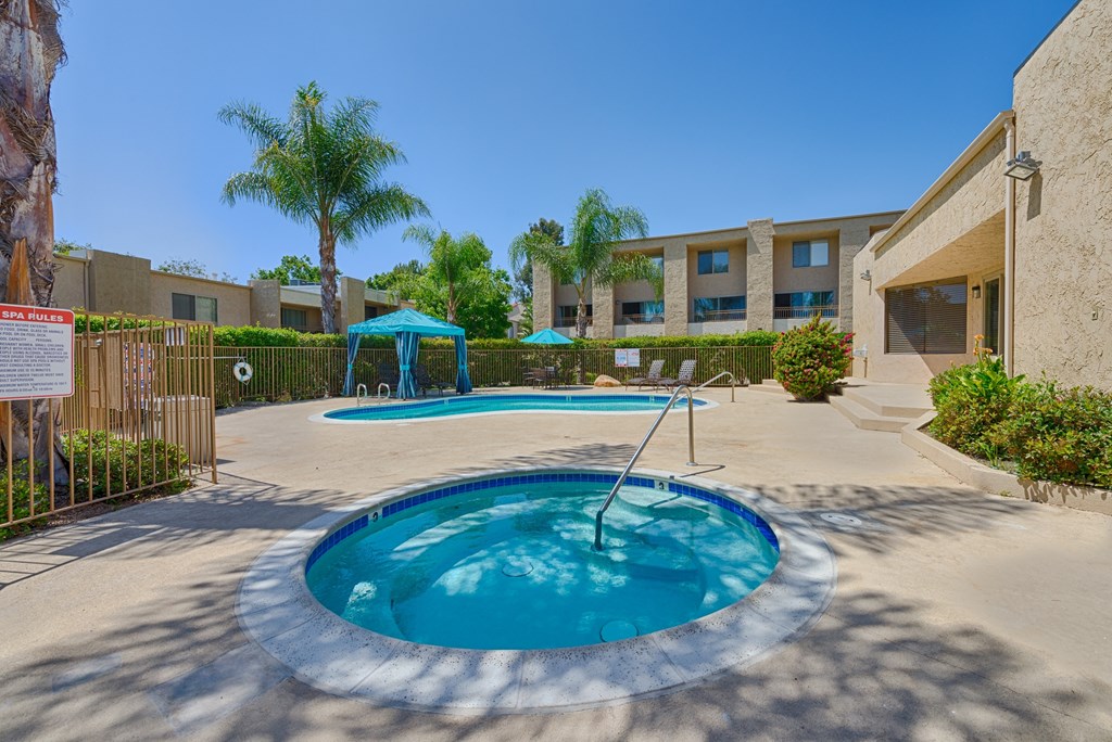 A small pool with a ladder in the middle of it.