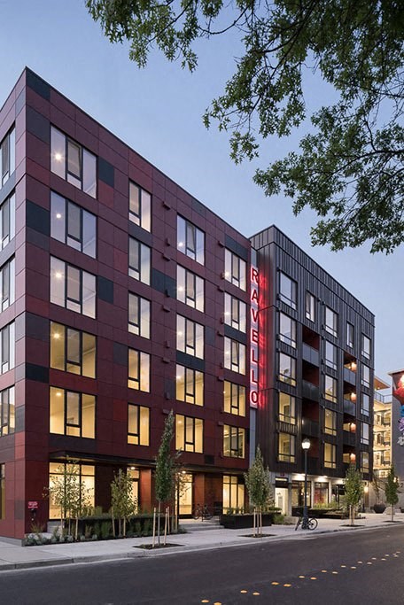 A red and black building with the word  at Ravello Apartments, Redmond, Washington