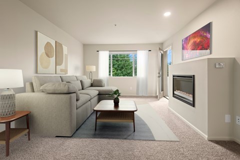A living room with a couch, a coffee table, and a painting on the wall.