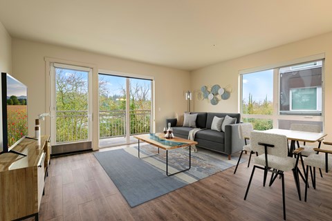A living room with a grey couch and a coffee table.